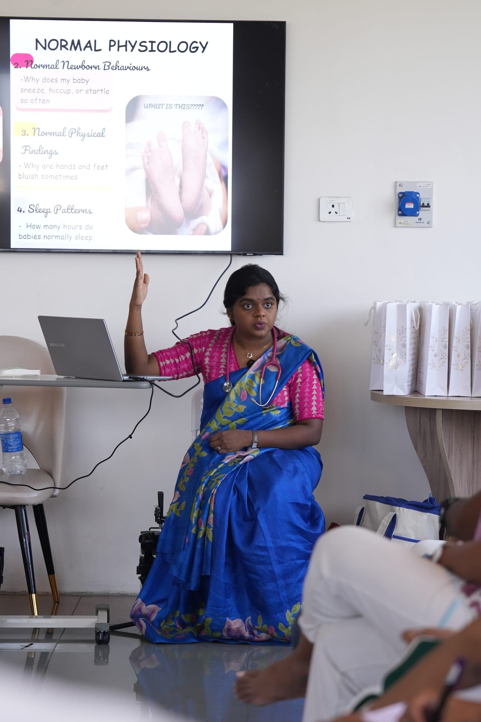 An expectant couple discusses birth preferences and options with a clinician.