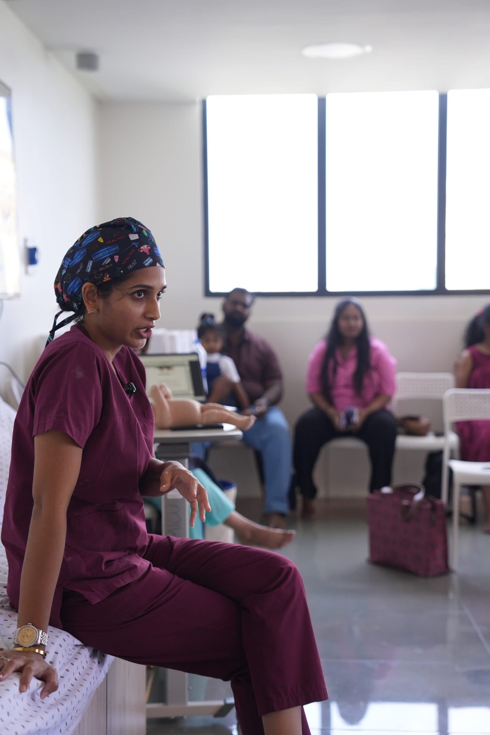 Doctor answering questions during a prenatal workshop